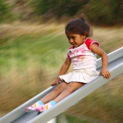 How can you go faster down a slide?