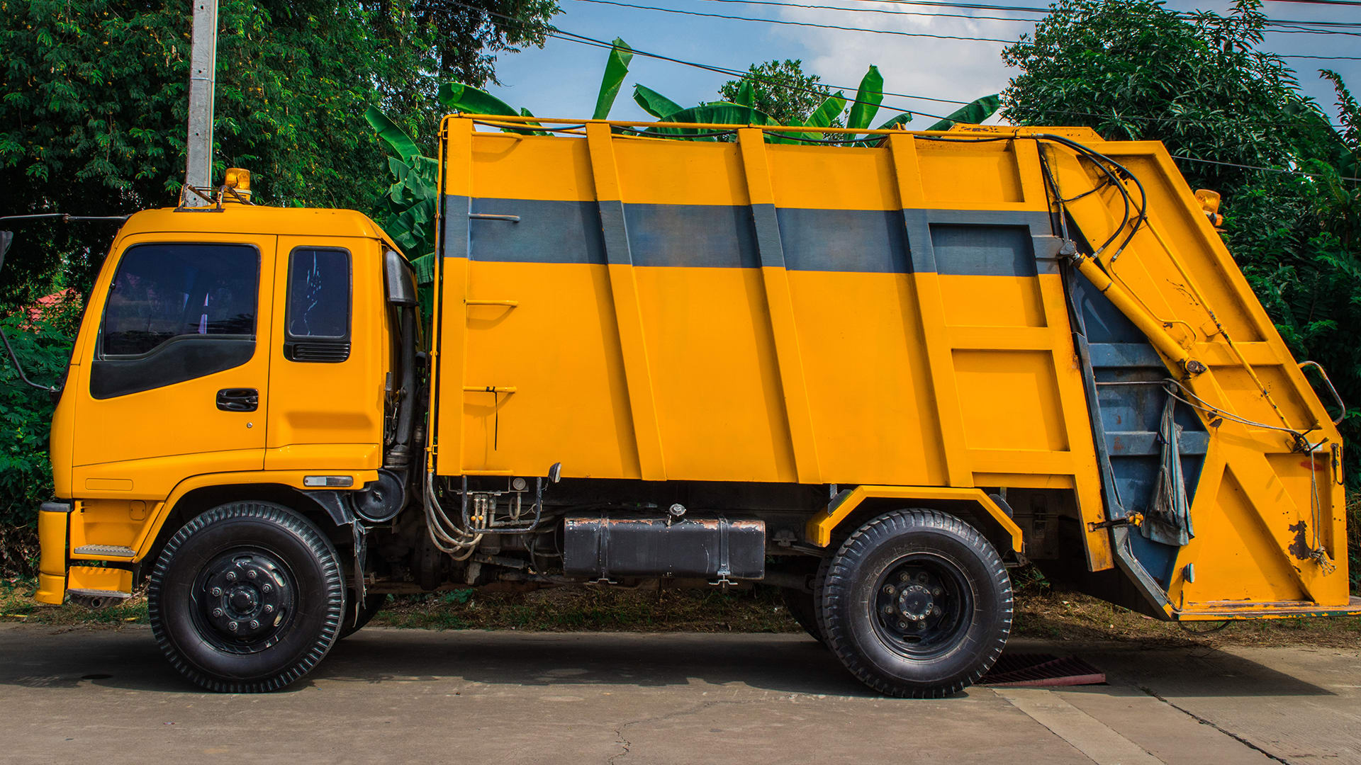 What do garbage trucks do with garbage?